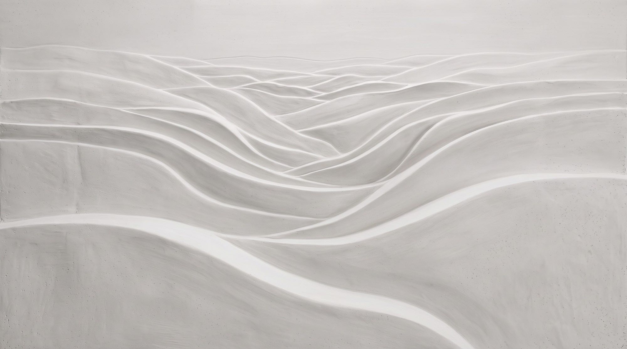 Plaster relief of rolling hills folding into one another towards a horizon
